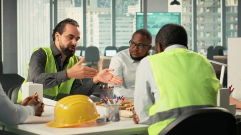 Diverse group of colleagues consulting on a master plan for urban development Stock Footage 320031030