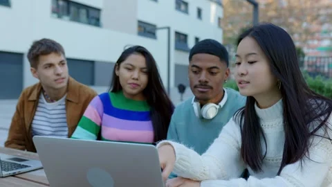 Diverse group of college students studying together at university campus Stock Footage 281153275