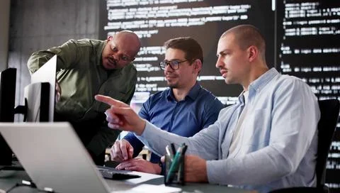 Diverse group of developers working on software programs 스톡 사진