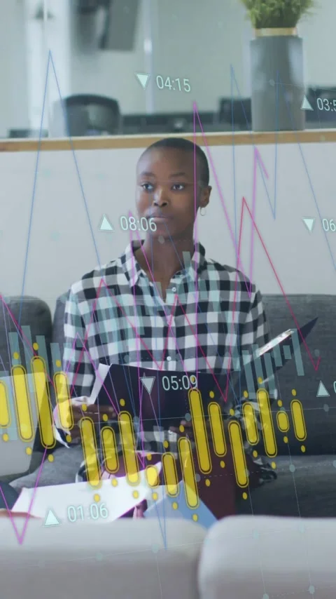 Diverse group discussing business data with financial graph animation overlay Stock Footage 344404141