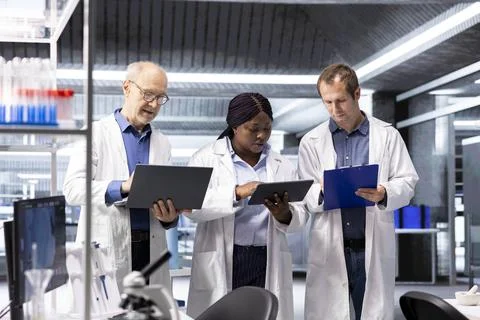 Diverse group of experts in the science lab conduct a research study Stock Photos