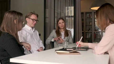 Diverse group of four talented young business people chatting about team Stock Footage 171992541