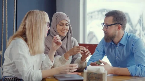 Diverse group of friends in a cafe. Stock Footage 107740055