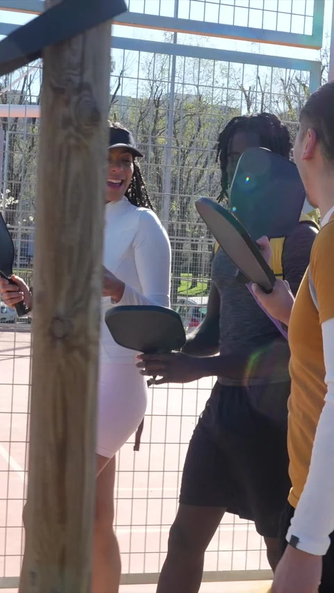Diverse group of friends walking to a pickleball match Stock Footage 334009922