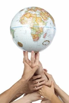 Diverse group of hands lifting a globe Stock Photos