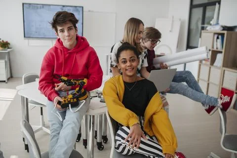 Diverse group of high school students with robotics project in classroom. Stock Photos