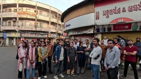 A diverse group of people walking together through a market area Stock Footage 346439132