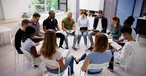 Diverse Group Reading And Studying Bible Stock Footage 246246783