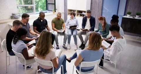 Diverse Group Reading And Studying Bible Vidéo 246575339