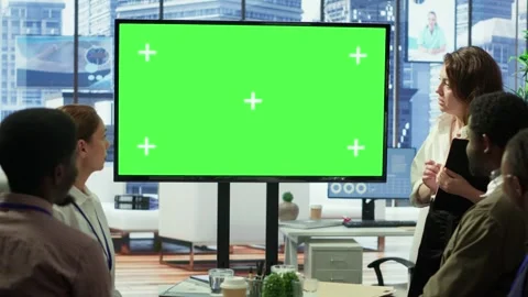Diverse group of startup employees looking at green screen on interactive board Stock Footage 318235495