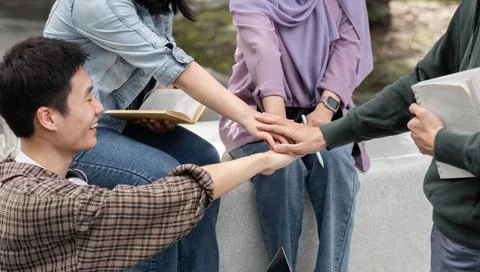 Diverse Group of Students Collaborating and Studying Together Outdoors for Stock Photos