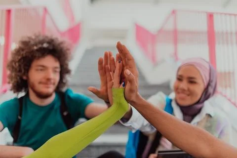 A diverse group of students symbolizes unity as Stock Photos