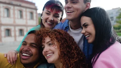 Diverse group of young people having fun outdoors in city Stock Footage 305705000