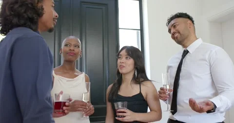 Diverse guests watching left navy jacket man telling story at reception amusing Stock Footage 339591512
