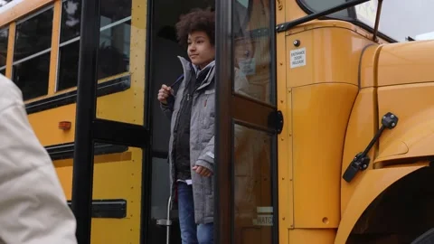 Diverse high school students leaving school bus Stock Footage 169655078
