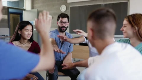 Diverse high school students taking with teacher during discussion group Stock Footage 261710316