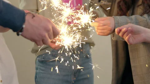 Diverse Hispanic Friends Dancing with Sparklers to the Rhythm of Music Stock Footage 257513159