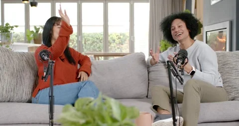 Diverse hosts left host waving, welcoming audience, introducing cohost, clapping Stock Footage 345607710