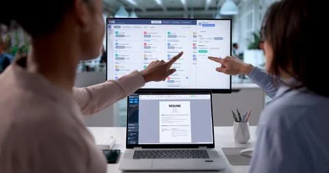 Diverse HR Managers Busy Scheduling Interviews For Job Applicants Online. Stock Photos