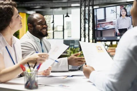 Diverse HR staff hosting a virtual meeting to interview a candidate Stock Photos