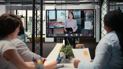 Diverse HR staff hosting a virtual meeting to interview a candidate Stock Photos