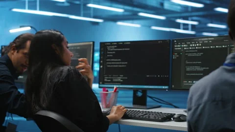 Diverse IT engineers in server room brainstorming ways to fix equipment Stockbeeldmateriaal 276194532