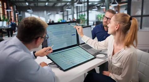 Diverse IT Support Team Works Together Solving Helpdesk Ticket Problems. Stock-Fotos