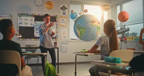 Diverse Kids Learning Science and Energy Resources in Modern Classroom Stock Footage 312821658