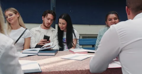 A diverse, large group of students, sharing knowledge in an urban setting 動画素材 253442681
