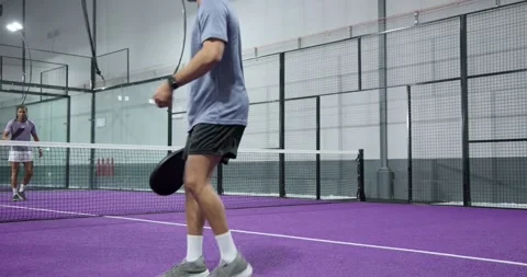 Diverse male athletes bouncing ball spurring volleying and returning serve on Vídeo Stock 343097682