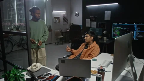 Diverse Male Developers Discussing Code on Glass Board in Office Stockbeeldmateriaal 348367341