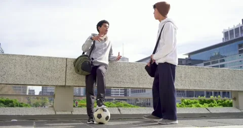 Diverse male friends responding to light tap, passing and juggling soccer ball Stock-Footage 340968799