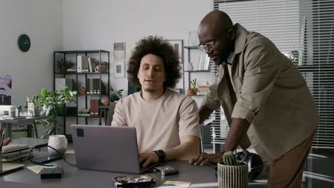 Diverse Male Programmers Discussing Html Code in Office Stock Footage 299209722