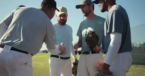 Diverse male teammates stacking hands on batting tee on baseball field, 動画素材 342798805