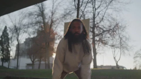 Diverse Man with Dreadlocks and Beard Plays Basketball Game on Outdoor Court at Stock Footage 270398406