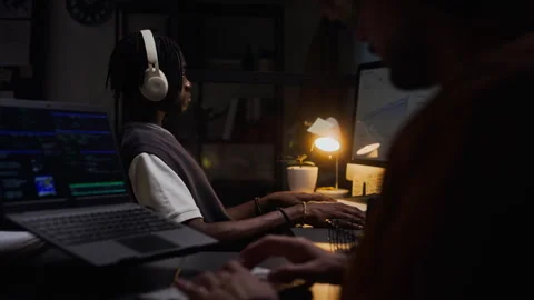 Diverse Men Coding Late on Computers in Dark Office at Night Stock Footage 338417889