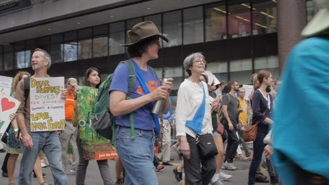 Diverse multi ethnic group of protestors at a climate change march Stock Footage 87787391