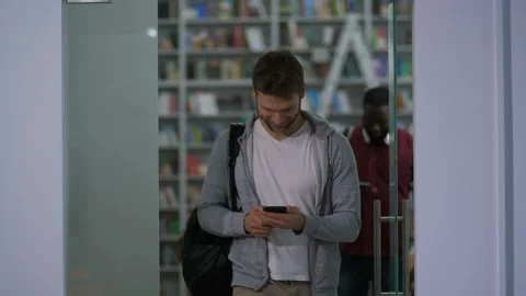 Diverse multi ethnic students leaving library Stock Footage 101981565