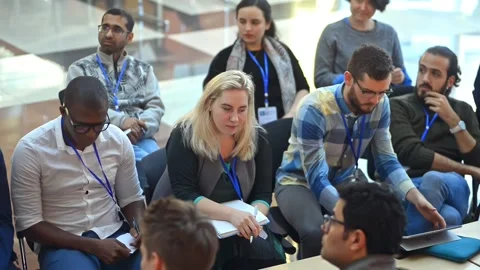 Diverse multicultural group of attentive people listen to conference seminar Stock Footage 137560078