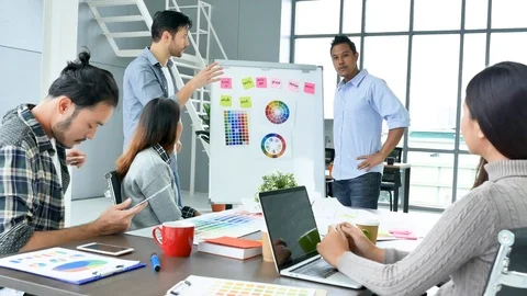 Diverse office team creative agency meeting present design ideas young startup g Stock-Footage 124193232