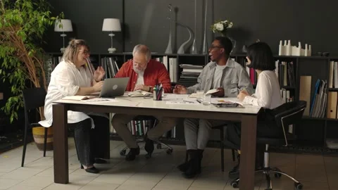 Diverse office team present new business project and discuss plan during meeting Stock Footage 166059393