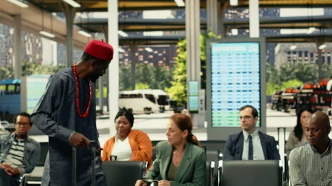 Diverse passengers accidentally bumping into each other in crowded bus stop Stock Footage 334729797