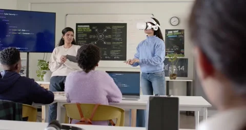 Diverse peers watching presenter cueing VR user putting on white headset, Stock Footage 341029461
