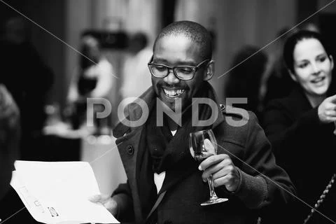 Diverse people at wine tasting event Stock Photos