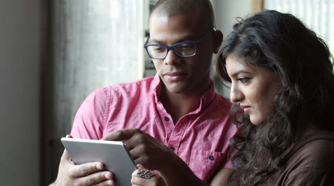 Diverse Professional Team standing/working on ipad/tablet, close up Stock Footage 53555677