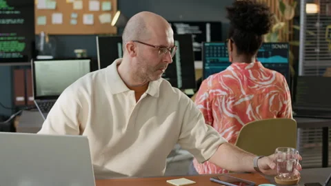 Diverse Programmers Coding in Modern Open Space Office Video stock 306835829