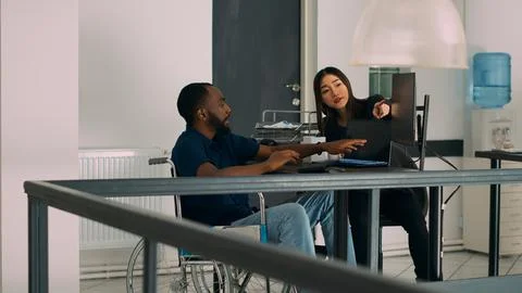 Diverse programmers collaborating on coding project compiling algorithm Stock-Fotos