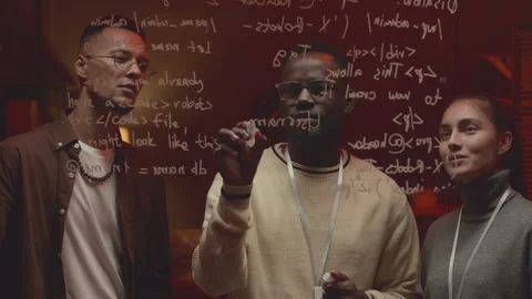 Diverse Programmers Creating New Command at Night Office Stock Footage 259168138