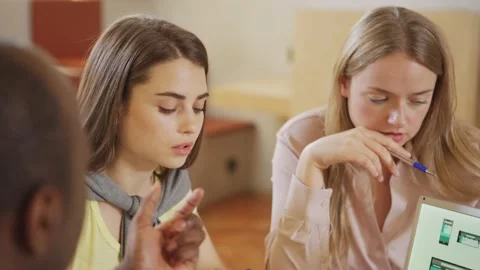 Diverse programmers discussing UI designs Stock Footage 142544135