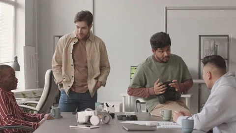 Diverse Programmers Discussing Video Game Development Stock Footage 172193256